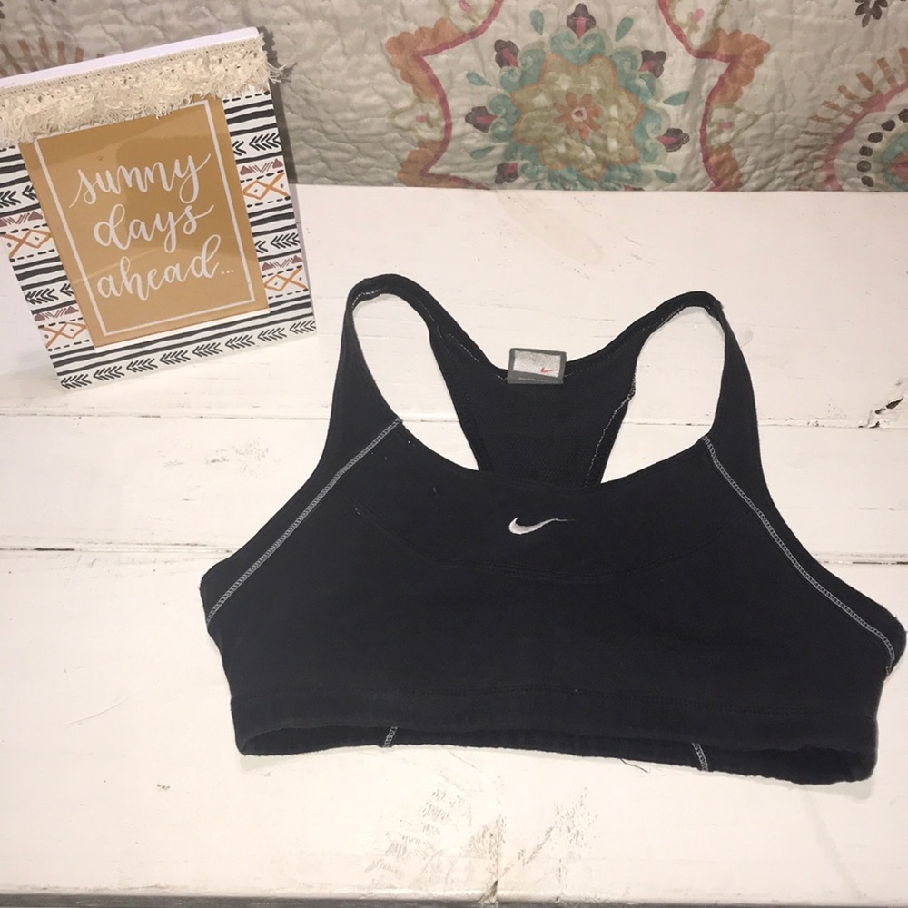 Woman’s black Nike sports bra